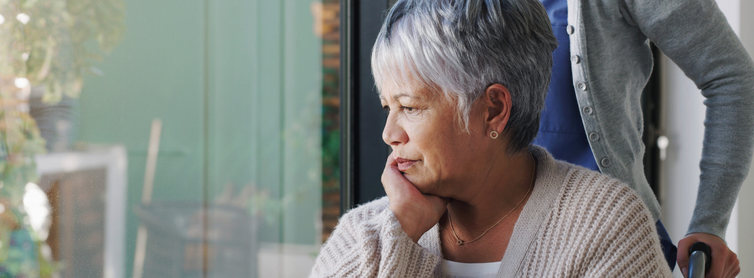 older lady being pushed in a wheelchair